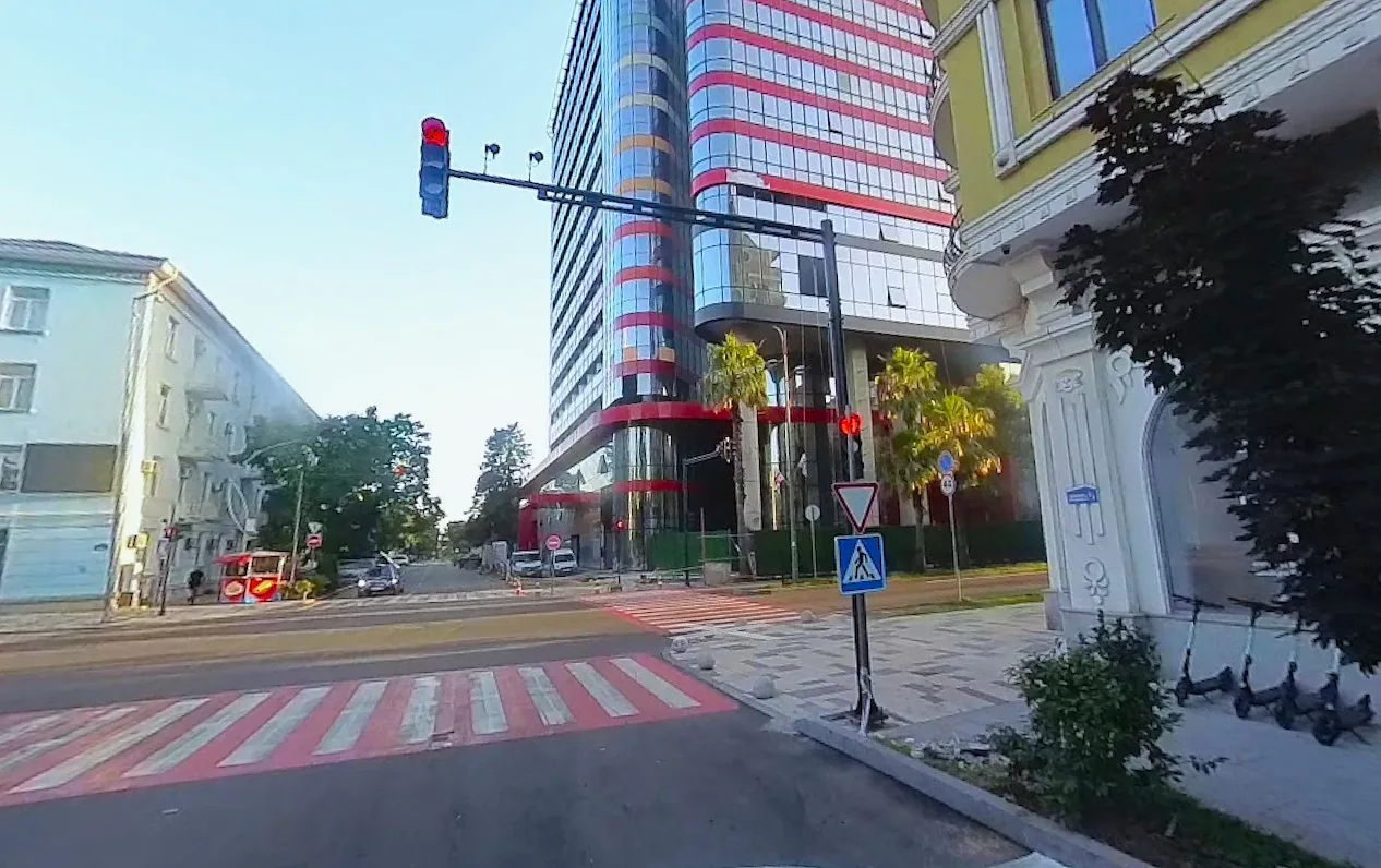 Modern tower and historic buildings on Rustaveli Avenue in Batumi